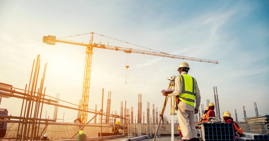 Construction site with workers and crane